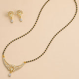 Gold-plated mangalsutra for women with black bead chain crescent pendant adorned with crystals and matching earrings for bridal use