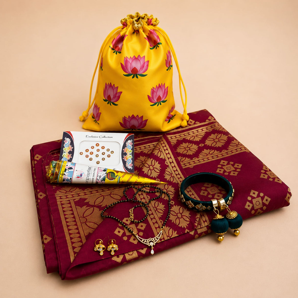 Yellow drawstring potli bag with pink lotus prints for karva chauth puja gift hamper and festive return gifts