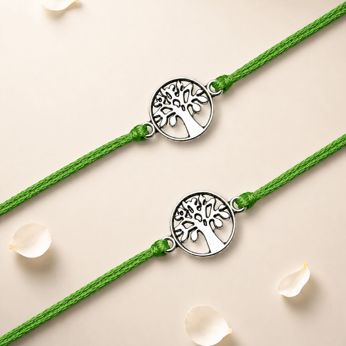 Two matching green cord tree of life charm rakhis with silver toned intricate cut out design bracelets for brother and bhabhi