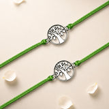 Two matching green cord tree of life charm rakhis with silver toned intricate cut out design bracelets for brother and bhabhi