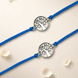 Blue cord bracelet with silver-toned circular tree of life charm featuring intricate cut-out detailing for raksha bandhan gift