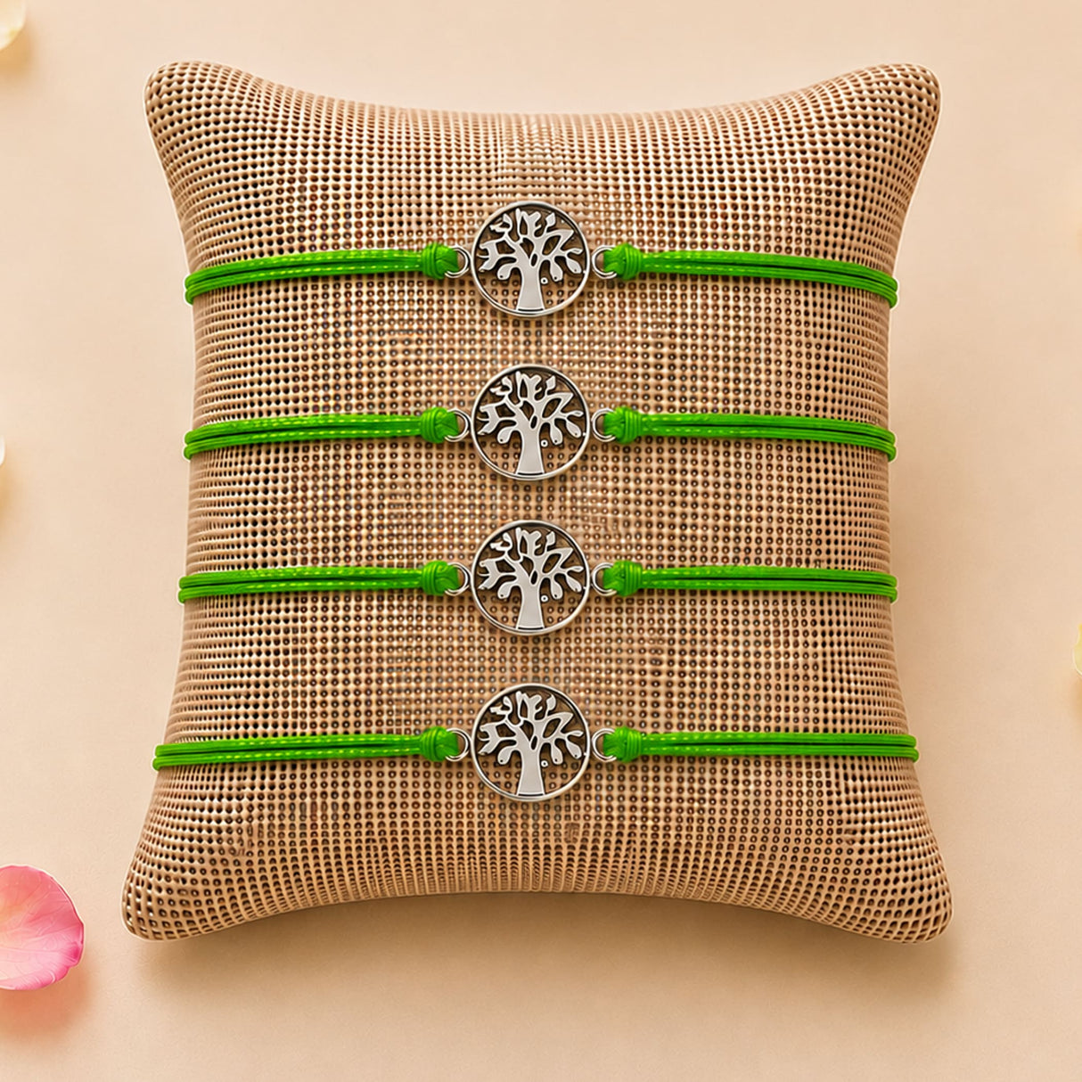 Four vibrant green cord bracelets with silver-toned tree of life charms for traditional raksha bandhan protection gift