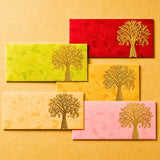Set of five colorful textured money envelopes with embossed golden tree of life design for indian wedding and cash gifts