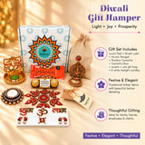 Golden ornate ganesh diya with red gemstone centerpiece in ultimate diwali gift hamper for festival celebration