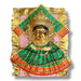Golden-faced Hindu deity statue with green and orange fabric for Vara Lakshmi idol Puja