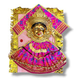 Golden Hindu deity figure wearing pink patterned clothing for Navaratri and Vratha puja