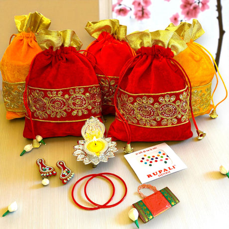 Festive red and gold gift bags featured in Varalakshmi Vratham Pooja Gift Hamper