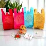 Colorful gift bags with intricate mandala design for Hindu religious ceremonies