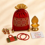 Red velvet potli bag with gold embroidered floral pattern and golden drawstrings for navaratri pooja gift hamper