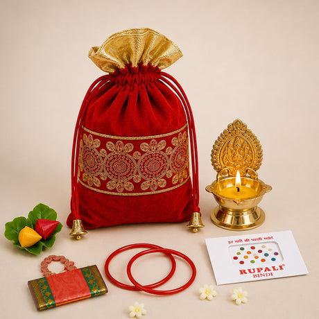Red velvet drawstring potli bag with gold embroidered patterns and golden bells for varalakshmi vratham gift hamper