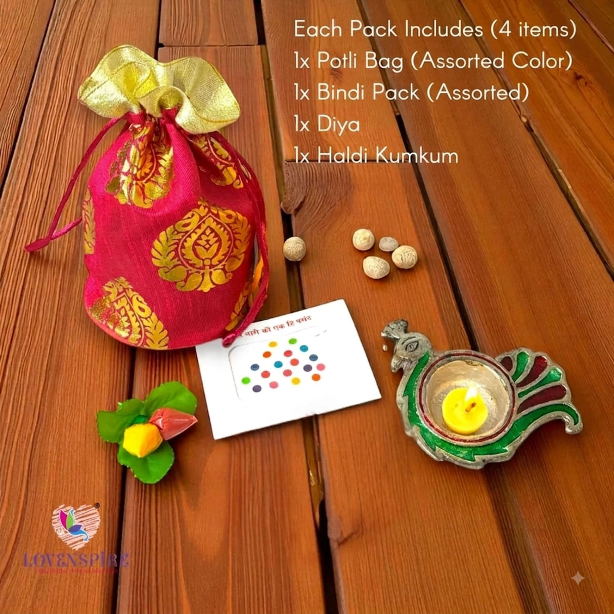 Vibrant red potli bag with golden paisley embroidery and matching gold drawstring in Varalakshmi Vratham gift hamper