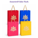 Assorted color paper gift bags with gold lotus designs and matching twisted handles for varalakshmi vratham gift hamper