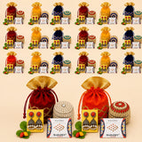Red and gold embroidered drawstring potli bags filled with traditional indian jewelry for religious and festive gifts