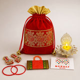 Red velvet drawstring potli bag with gold embroidered patterns and golden ruffled top for hindu pooja gifts