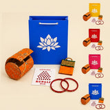 Orange embroidered cylindrical jewelry box from varalakshmi vratham gift hamper for pooja and housewarming use