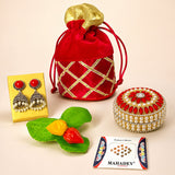 Red velvet drawstring potli bag with gold trim and golden fabric top for varalakshmi vratham gift hamper and pooja use