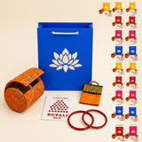 Orange embroidered cylindrical bangle case included in varalakshmi vratham gift hamper for pooja and housewarming