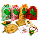 Set of four satin drawstring potli bags in mint pink gold and red with green parrots and jeweled necklaces for varalakshmi vratham gift hamper