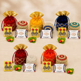 Red velvet drawstring potli bag with gold trim and golden fabric top for varalakshmi vratham gift hamper and pooja returns