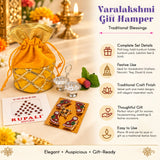 Golden drawstring potli bag with metallic lattice detailing featured in varalakshmi vratham gift hamper for pooja and festivals