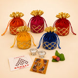 Vibrant velvet drawstring potli bags in orange red and blue with gold lattice detailing for hindu religious gifting occasions