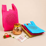 Vibrant pink reusable non woven carry bag with black floral mandala design for Varalakshmi Vratham gift hamper use