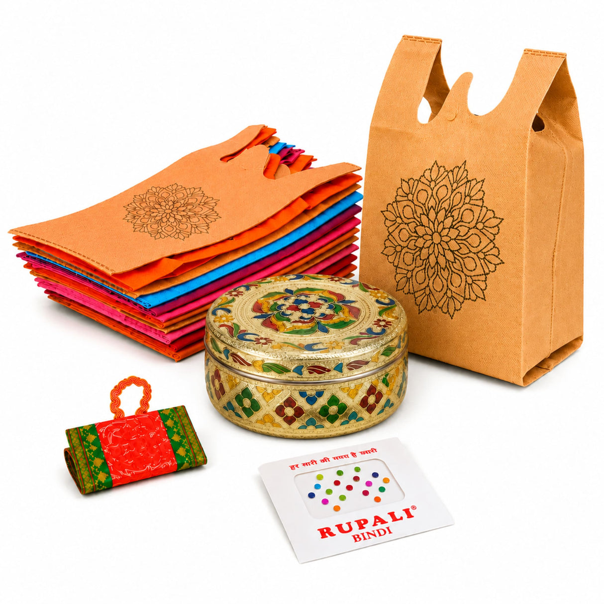 Gold-colored ornate metal box with intricate floral and geometric patterns in a varalakshmi vratham gift hamper for women