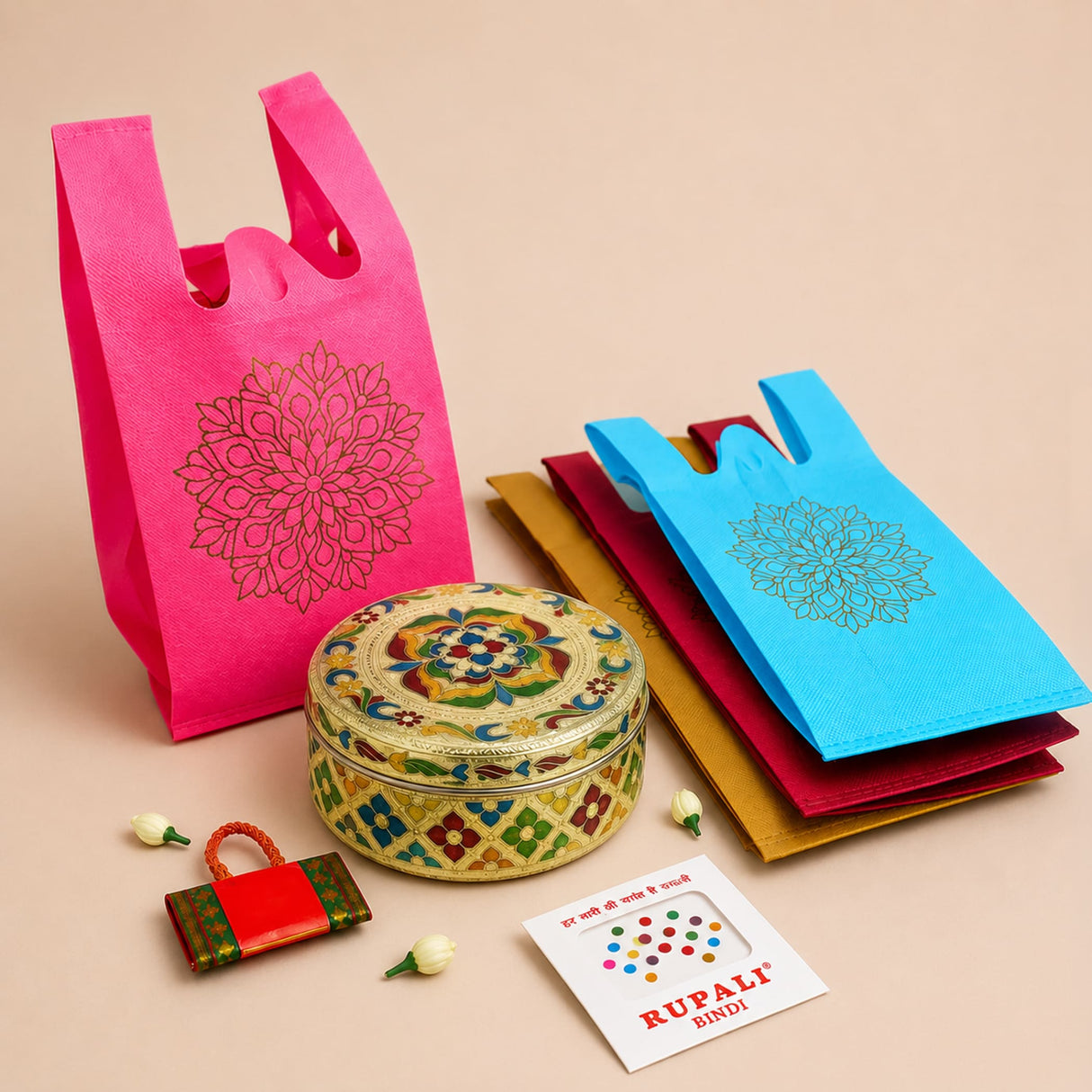 A vibrant pink reusable non-woven shopping bag with gold foil mandala design from varalakshmi vratham gift hamper for women