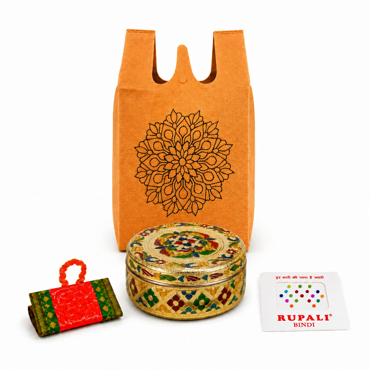 Ornate gold and multicolored enamel-decorated circular tin box in varalakshmi vratham gift hamper for pooja and navratri