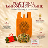 Orange non-woven fabric gift bag with intricate black mandala design for pooja and festive return favors