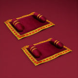 Pack of 2 maroon velvet prayer mats with gold borders and cushions for Laddu Gopal