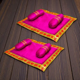 Vibrant pink satin prayer mats with gold borders and cushions for Laddu Gopal
