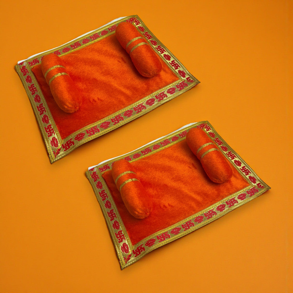 Pack of 2 orangish-red velvet prayer mats with gold borders for Laddu Gopal