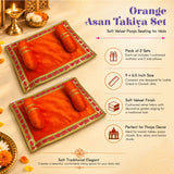 Orange velvet asan takiya set with golden embroidered edges and matching cushioned side pillows for pooja rituals