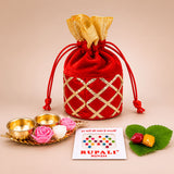 Red velvet drawstring pouch with gold metallic lattice pattern and golden ribbon tie for varalakshmi vratham gift hamper