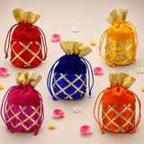 Assorted traditional indian velvet potli bags in red blue pink and orange with gold lattice gota patti work and drawstring closure