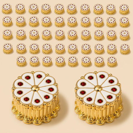 Gold-toned floral-shaped enamel pins with red gemstone accents and central gold bead for traditional ritual use