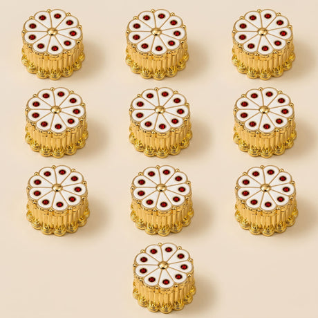 Gold-colored circular enamel decorative knobs with white and red floral design for white haldi kumkum plastic holder