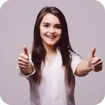 Smiling woman with long dark hair giving thumbs up with both hands.