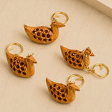 Hand-carved wooden duck keychains with intricate circular cutouts and gold-toned metal rings for good luck gifts