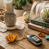 Gold turtle-shaped keychain attached to car key fob as part of 4pc wooden keychain set for thanksgiving gift