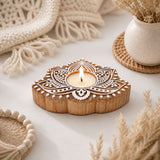Wooden lotus-shaped tealight candle holder with intricate white carved patterns for diwali decoration and worship