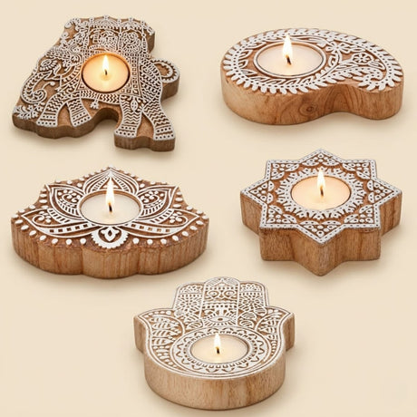 Hand carved wooden block print tealight holders with white etched designs in natural wood tones for diwali decoration