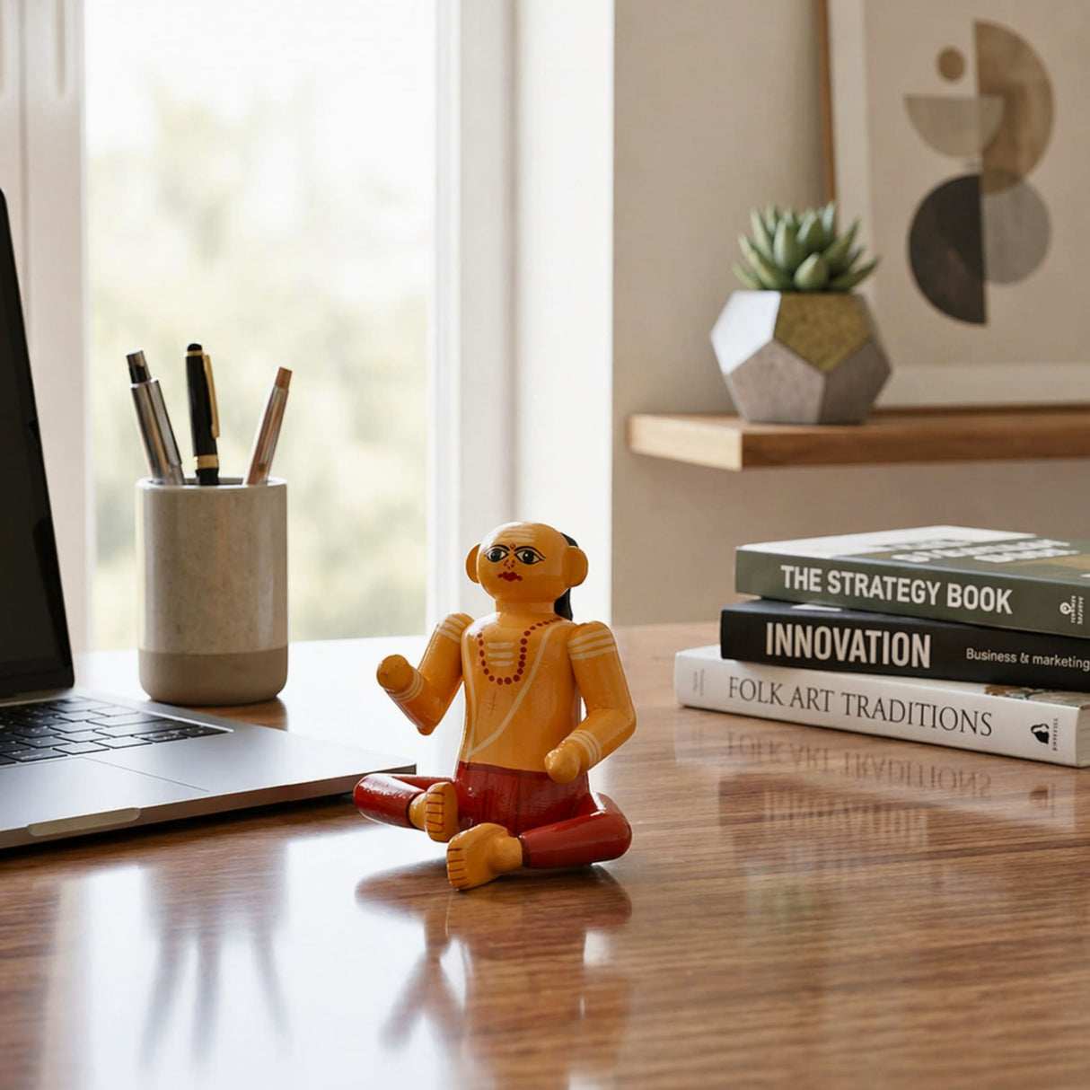 A vibrant orange and red handpainted wooden Brahmin doll with detailed facial features and beads for home decor