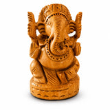 Hand-carved wooden Ganesha idol with intricate details and warm golden-brown finish for pooja and home decor