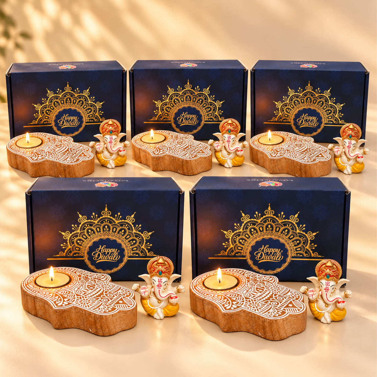 Wooden hand-shaped hamsa tea light candle holders with intricate white carvings and ganesha figurine in diwali gift hamper