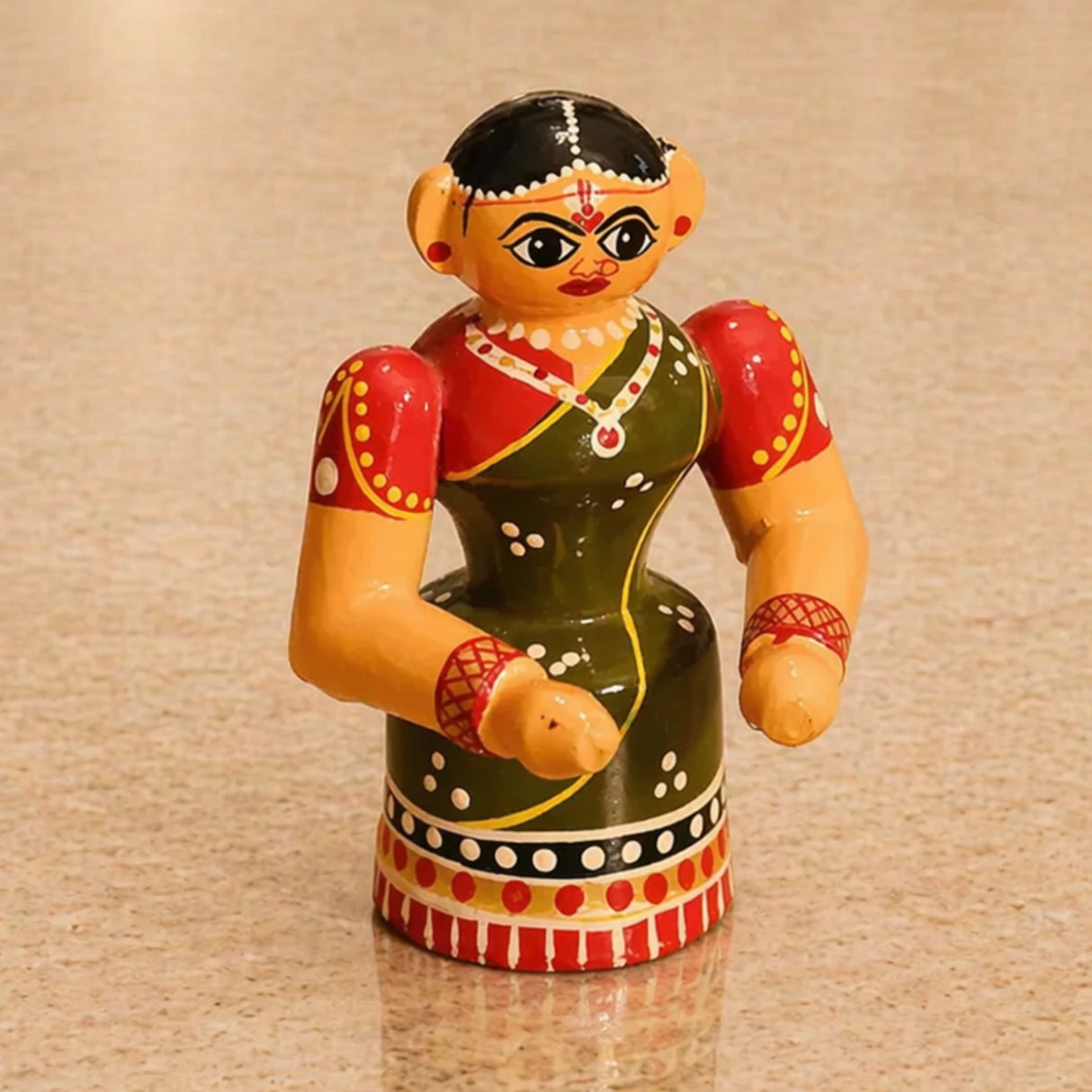 Hand-painted wooden Kondapalli bride figurine in vibrant red green and yellow for traditional Golu decor and gifting