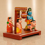 Hand-painted wooden krishna makhan chor leela figurine with blue-skinned deity on lion and colorful saree women for janmashtmi decor