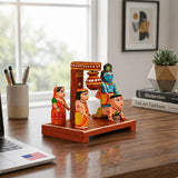 Hand-painted wooden krishna makhan chor leela figurine in vibrant traditional attire for janmashtmi golu decoration