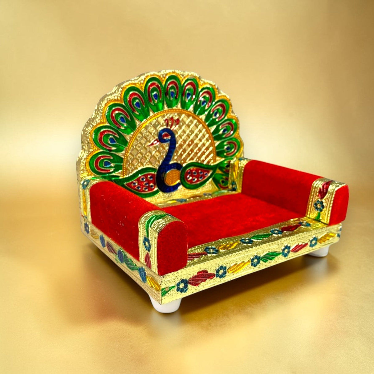 Wooden laddu gopal sinhasan with vibrant red velvet cushion and golden peacock motif for pooja mandir and janmashtami gift